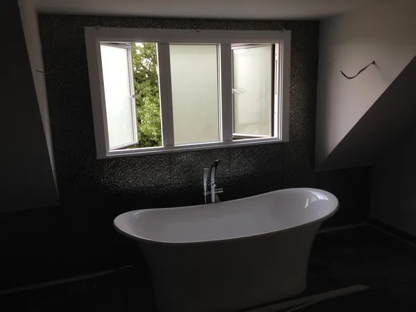 Roll-top freestanding bath installation Kent