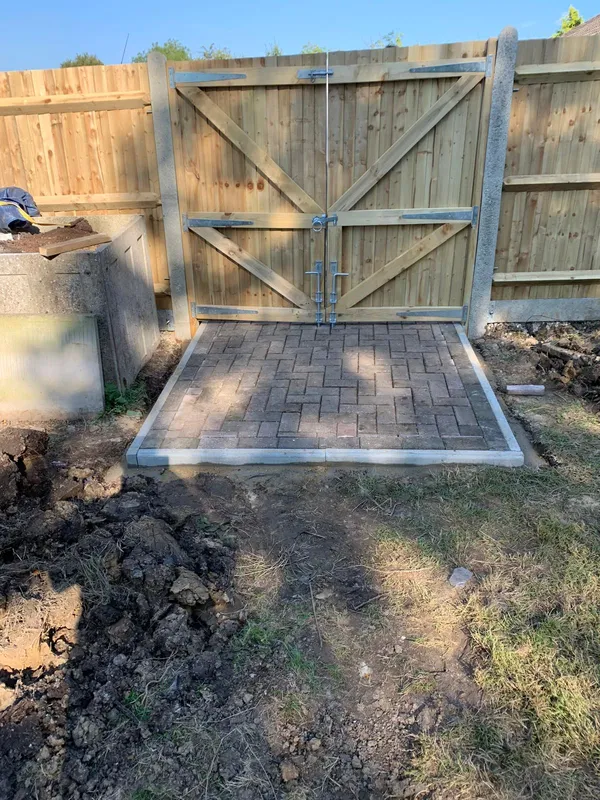 Square block paved section behind gate for a landscaping project in Kent