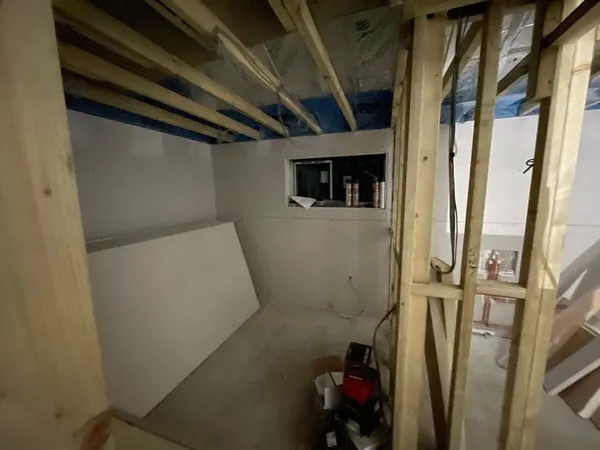 Plasterboard being installed on a conversion project in Kent