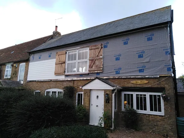 Exterior white cladding installation for a local project in Kent