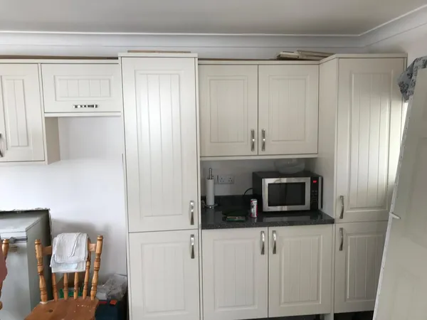 Kitchen units being installed