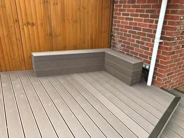 Grey decking seat area for a landscaping project in Kent