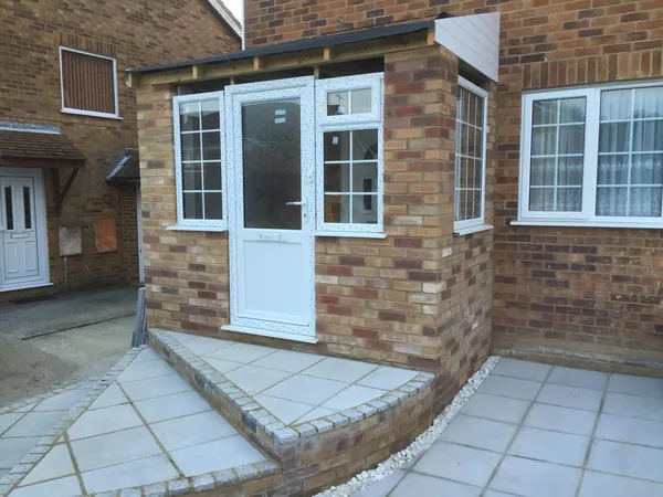 Grey slab installation front of house for local landscaping project in Kent
