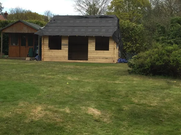 Roof installation on local landscaping project custom built summer house