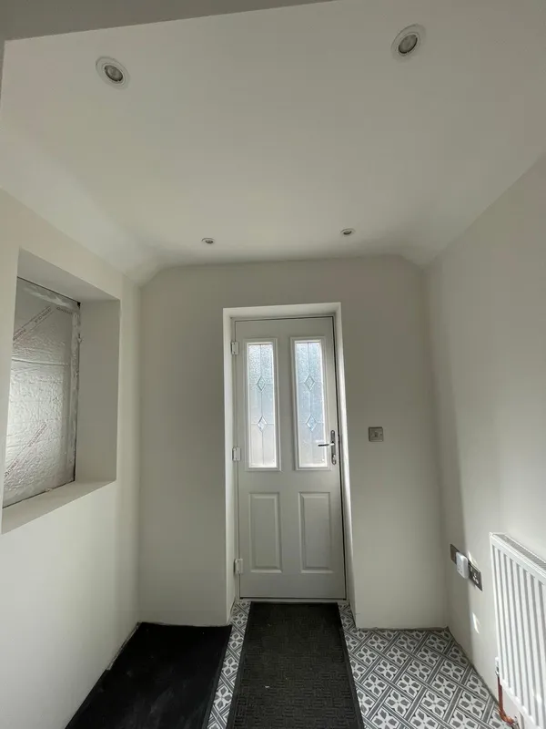 Patterned floor tile installation with painted white walls for a decorating project in Kent