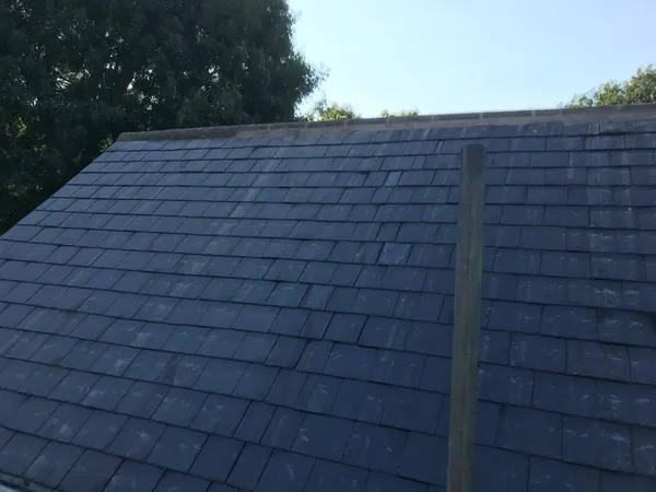 Roof project with slate tiles and ridge installation Kent