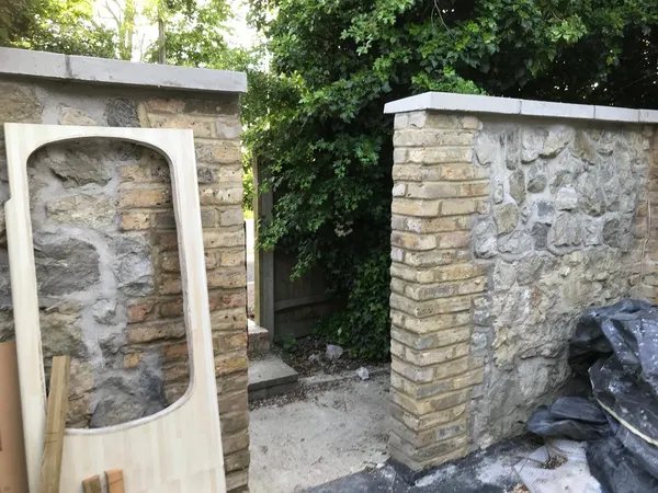 Natural stone wall with a top slab for a local extension project, Kent