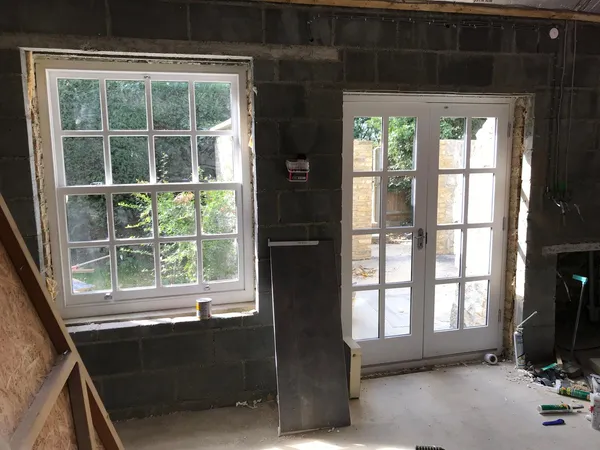 Window and door installation on a stone extension project, Kent