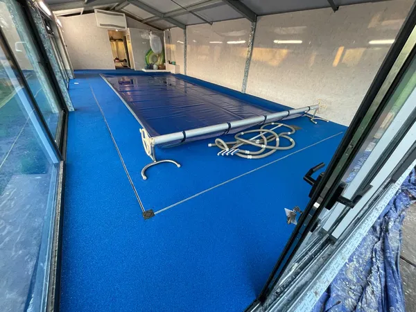 Back view of swimming pool floor installation, Ashford