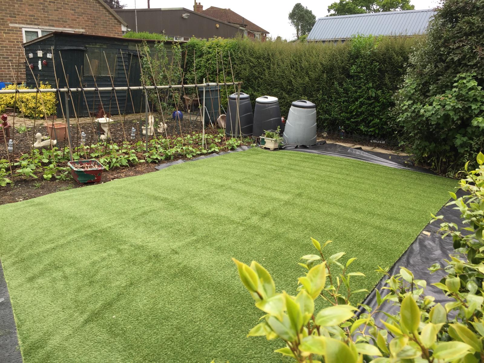 Artificial grass installation for a local garden project in Kent