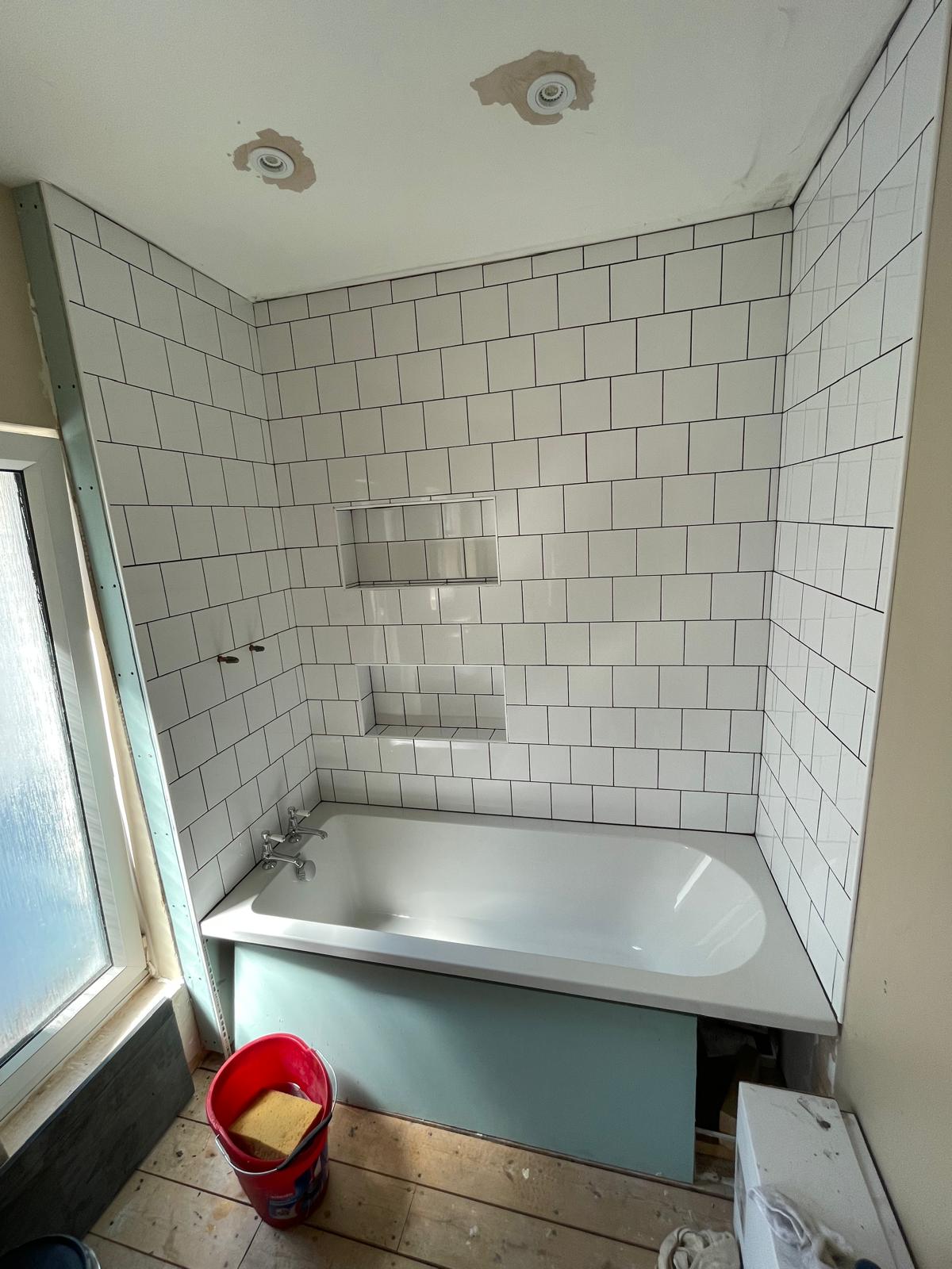 Bath and wall tile installation on a re-fit bathroom project 