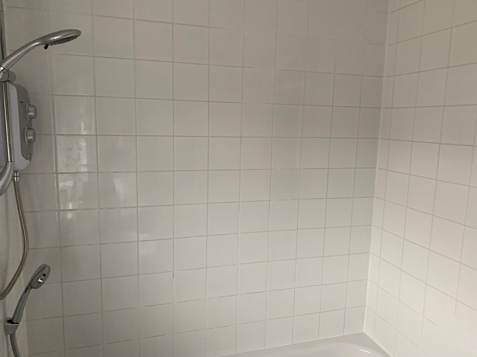 Bathroom decorating project with white wall tile installation