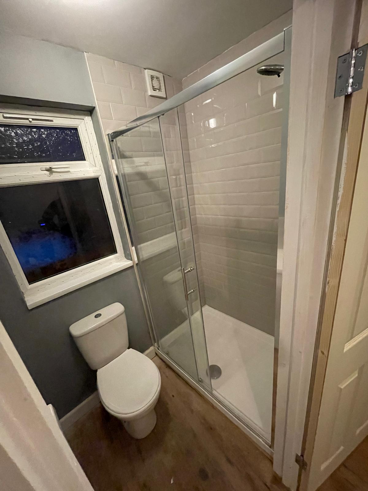 Bathroom painting and decorating project with shower tile installation