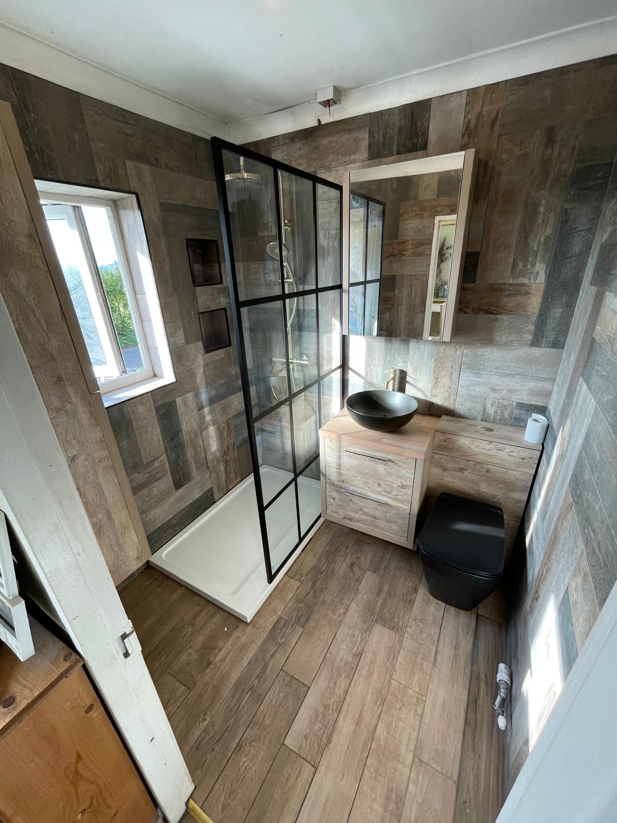 Bathroom project in Kent with wood effect wall tiles shower and bowl sink 
