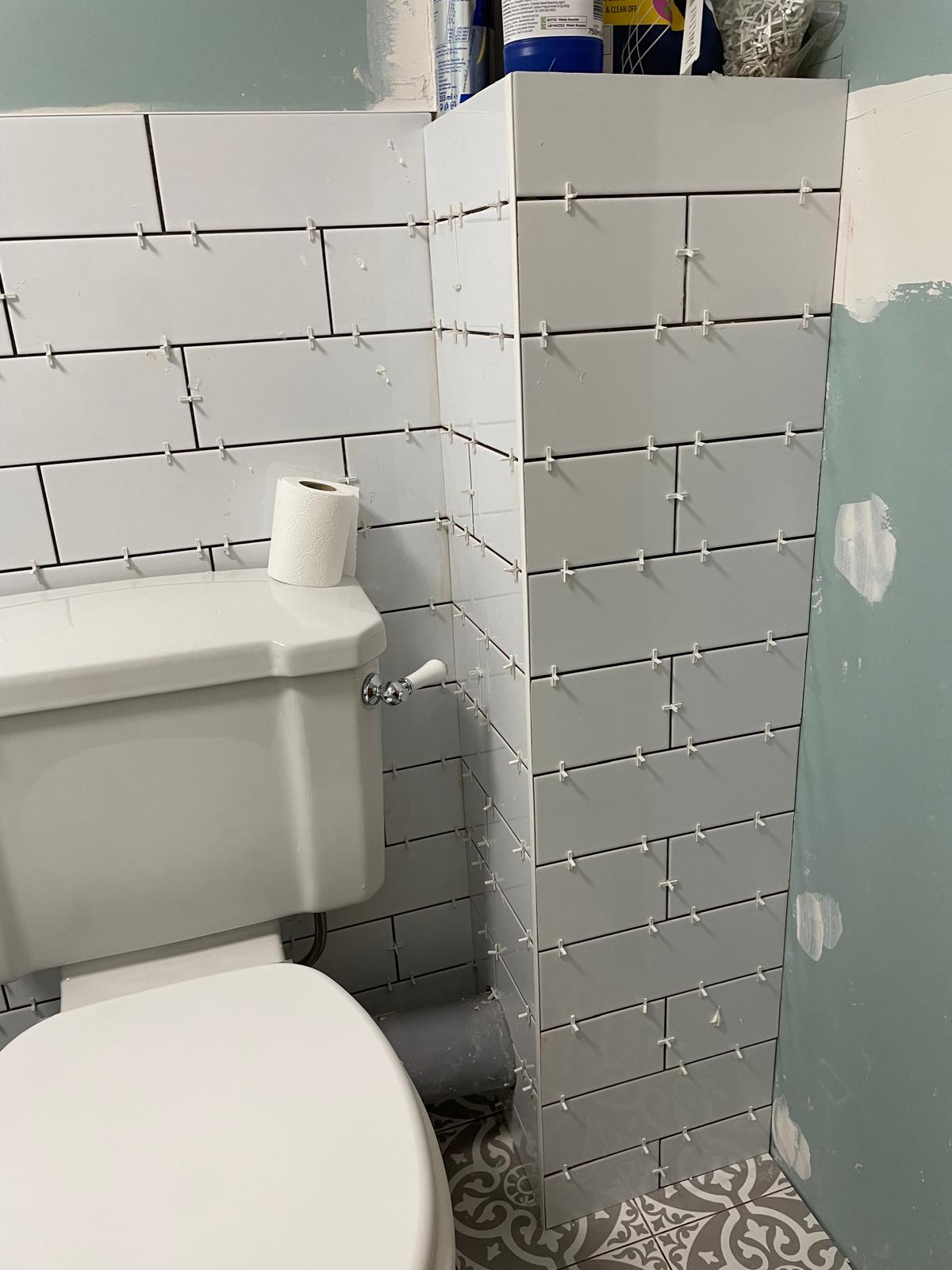 Bathroom project white tile installation