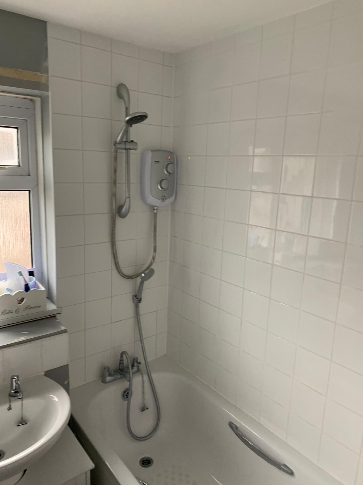 Bathroom project with white wall tile installation