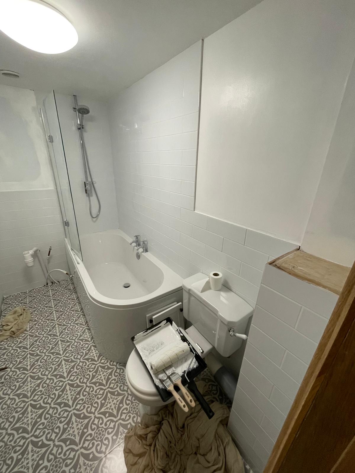 Bathroom project with white wall tiles and pattern floor tiles