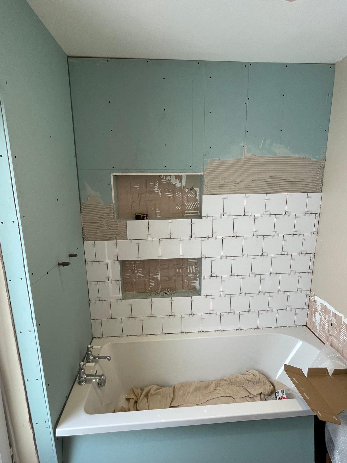 Bathroom re-fit project white square wall tile installation 