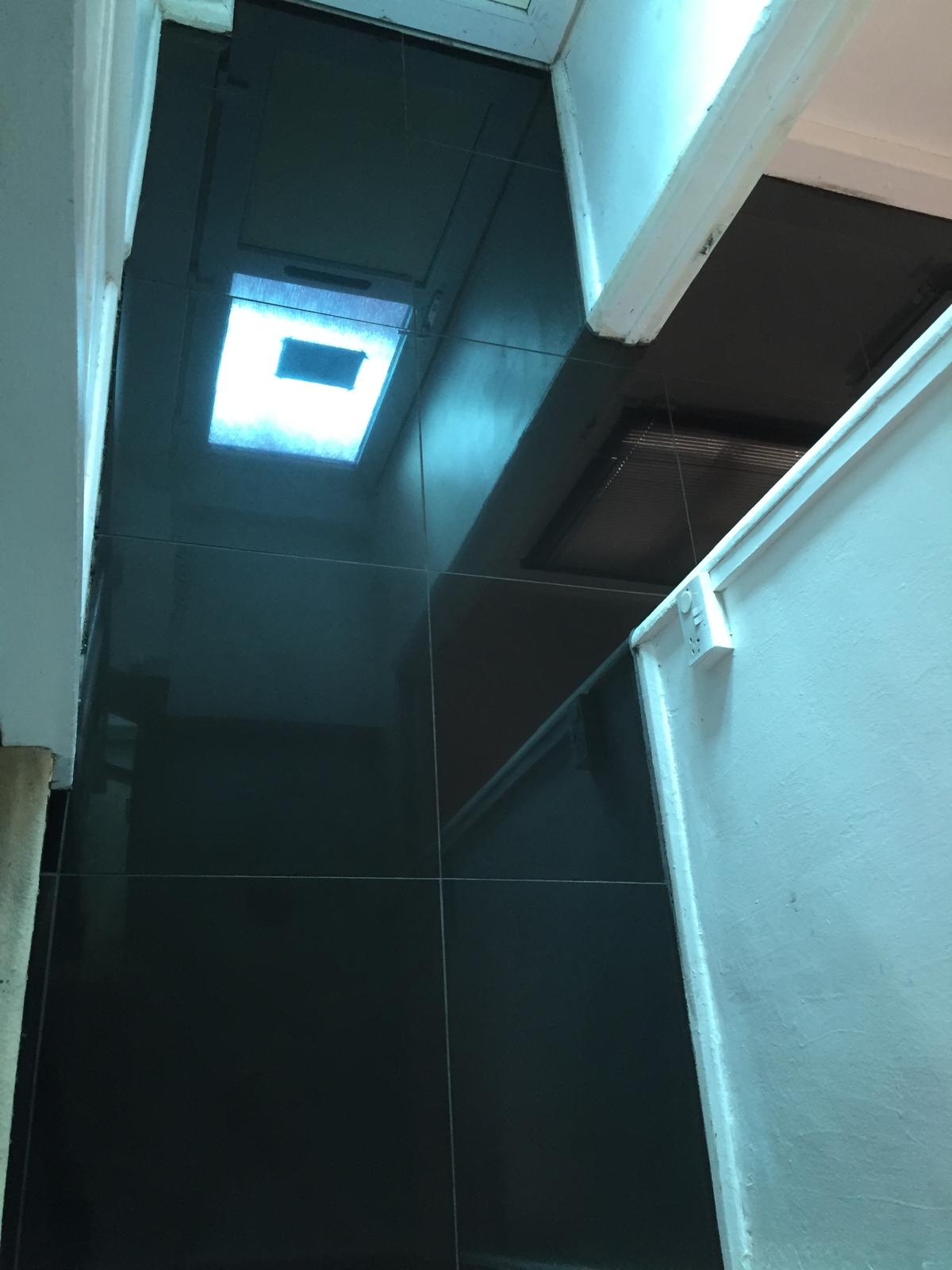 Black gloss porcelain tile installation for a local decorating project in Kent 