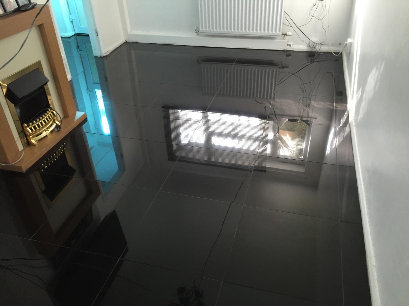 Black gloss square floor tile installation in front room for a decorating project in Kent 