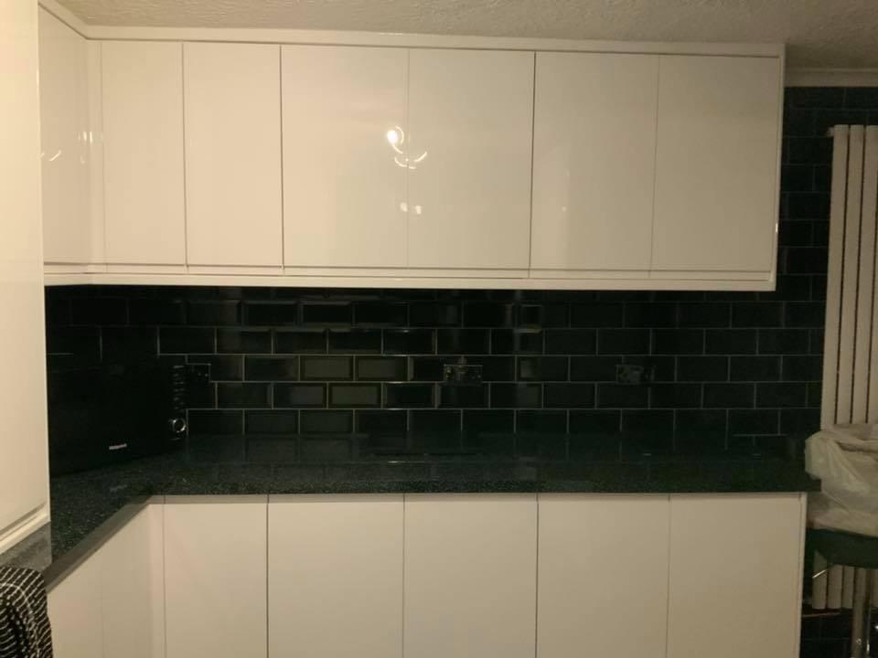 Black wall tile installation on kitchen project