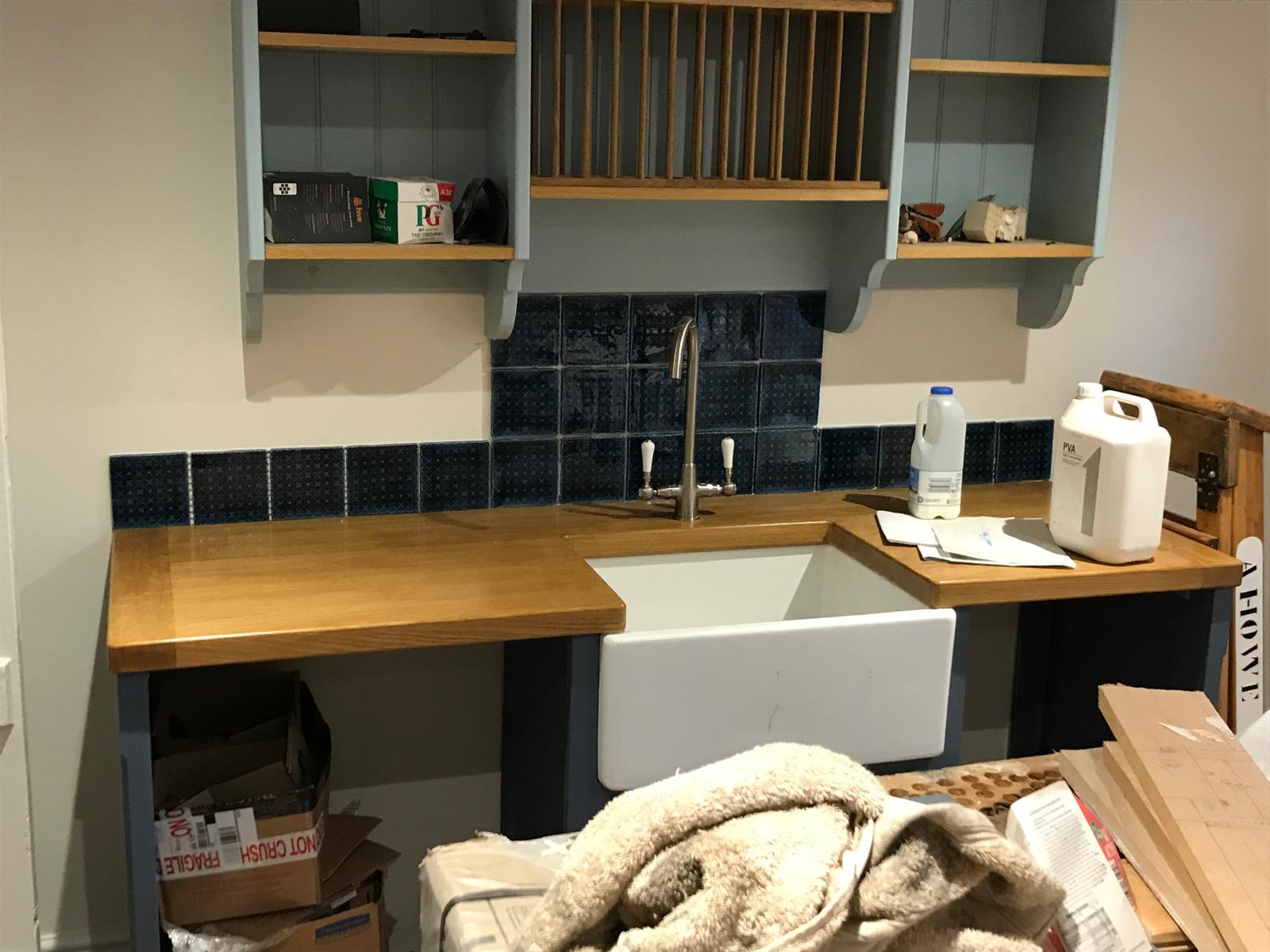 Black wall tile installation for a kitchen project