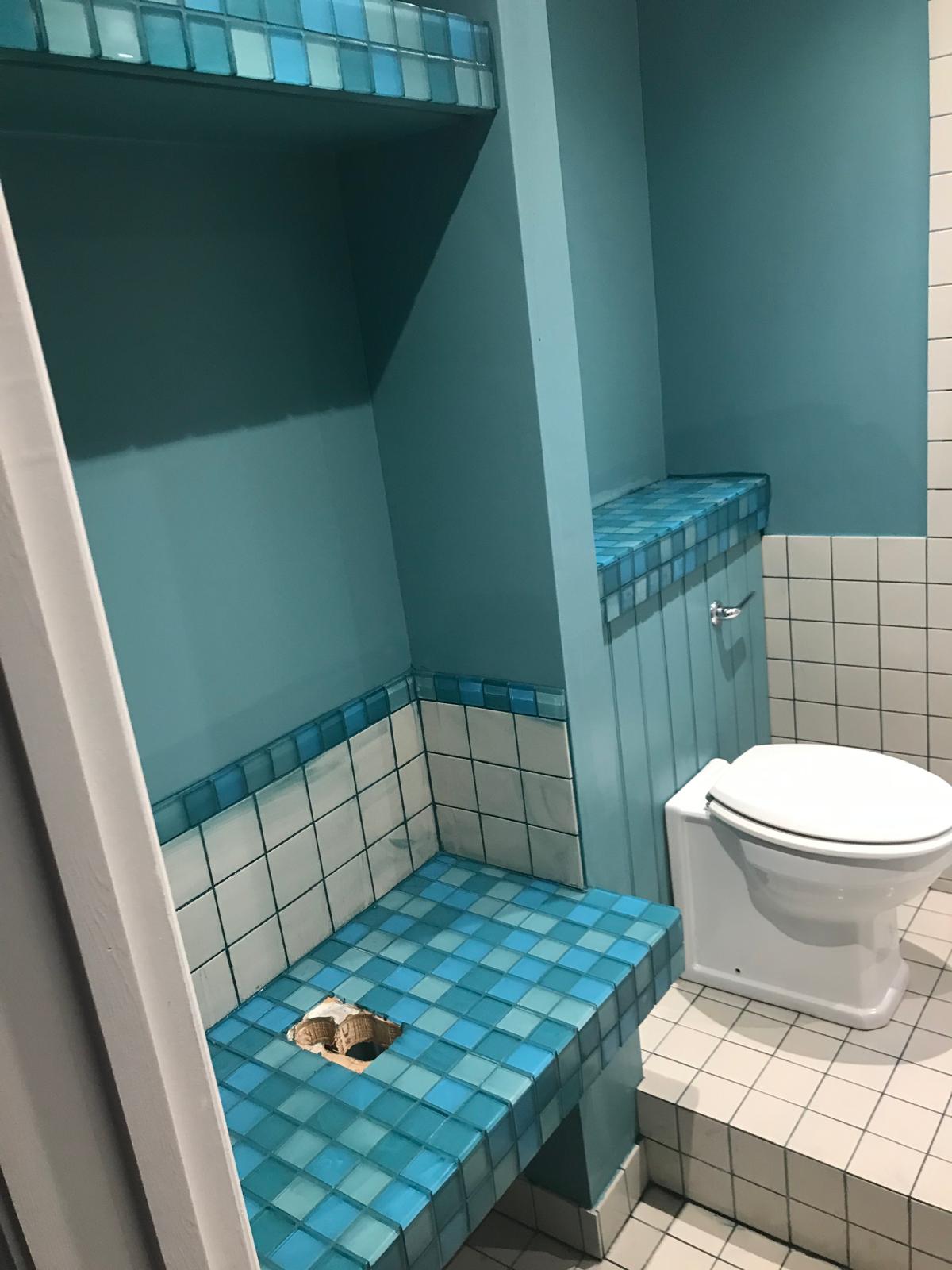 Blue mosaic tiles installed ready for sink installation