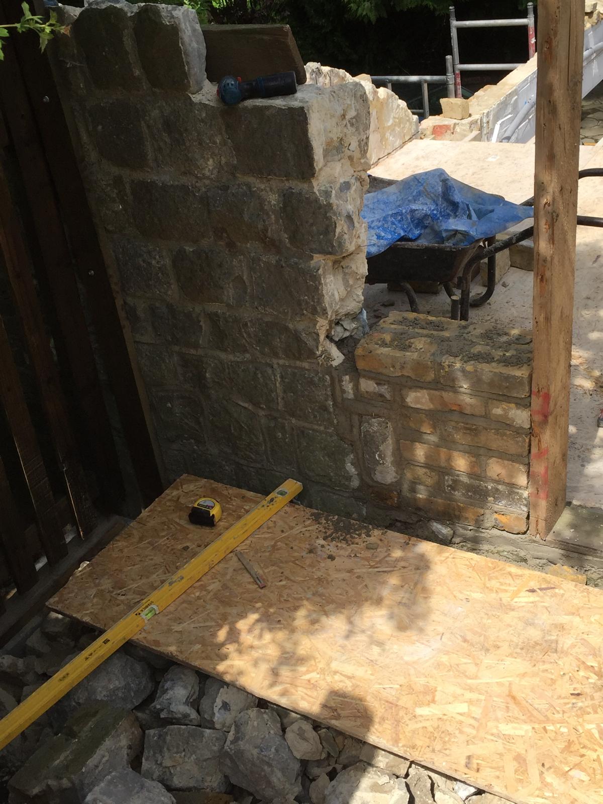 Brick and stone wall installation for local project