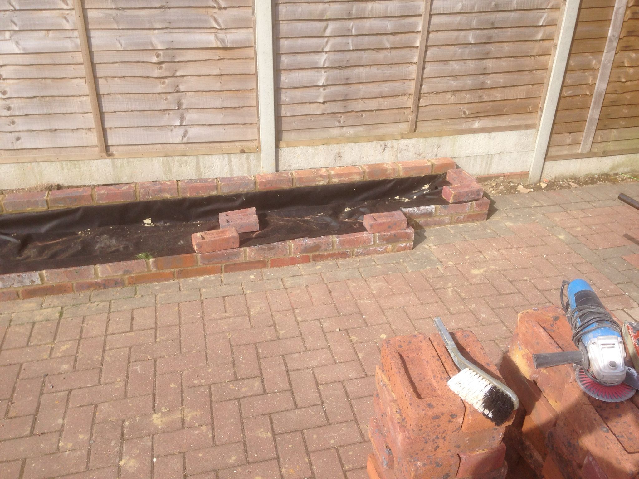 Brick border being built for local landscaping project
