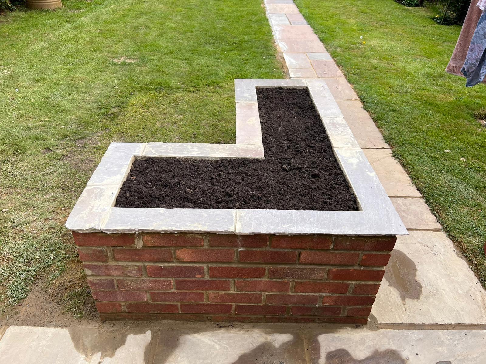 Brick built corner planter for a landscaping project in Kent