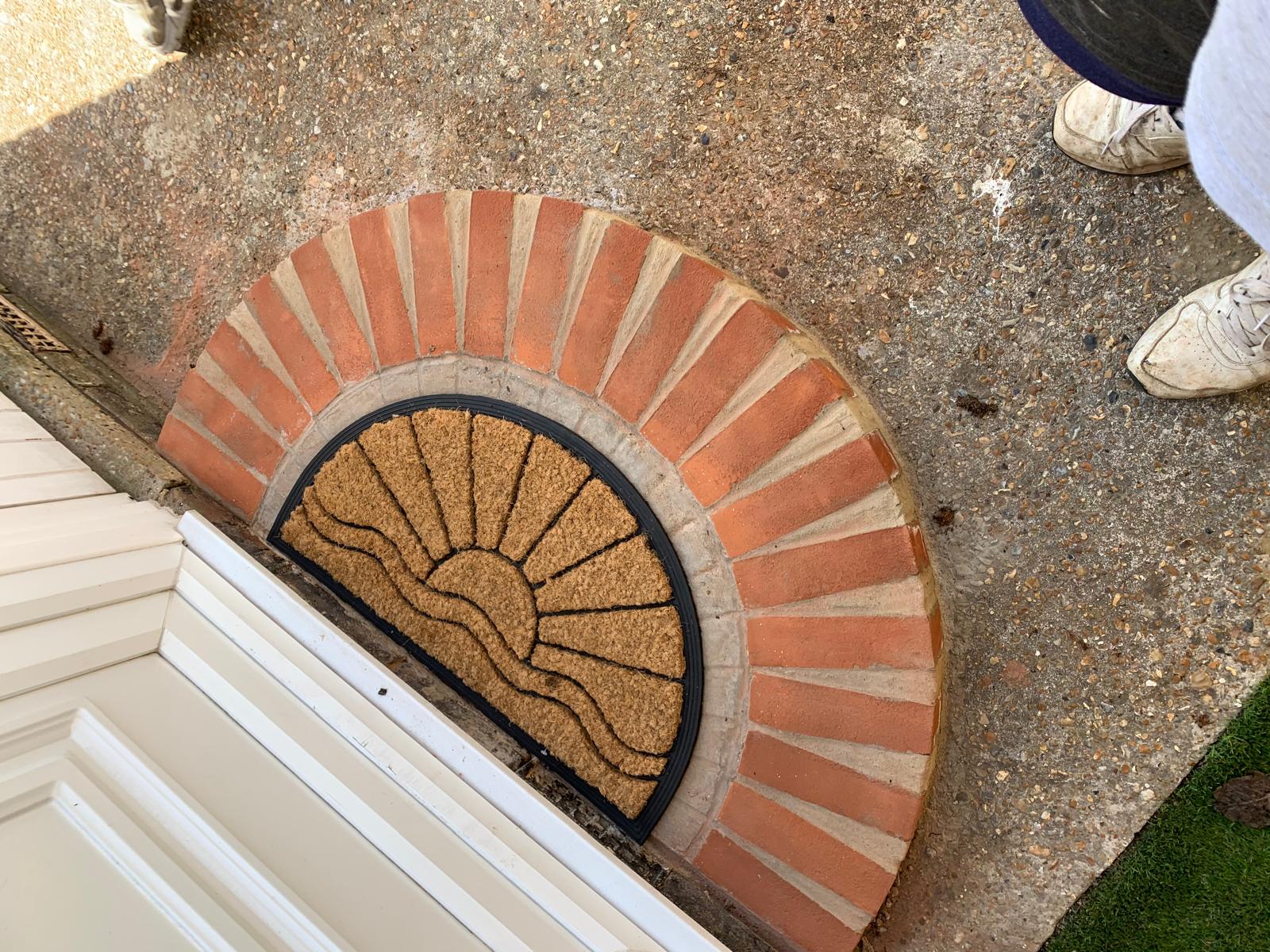 Brick half moon step outside front door installation for a local project in Kent