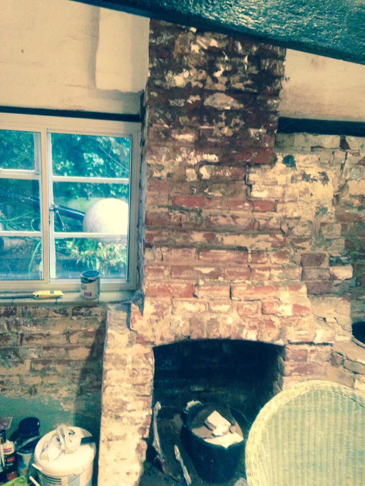 Brick work restoration round chimney on a decorating project
