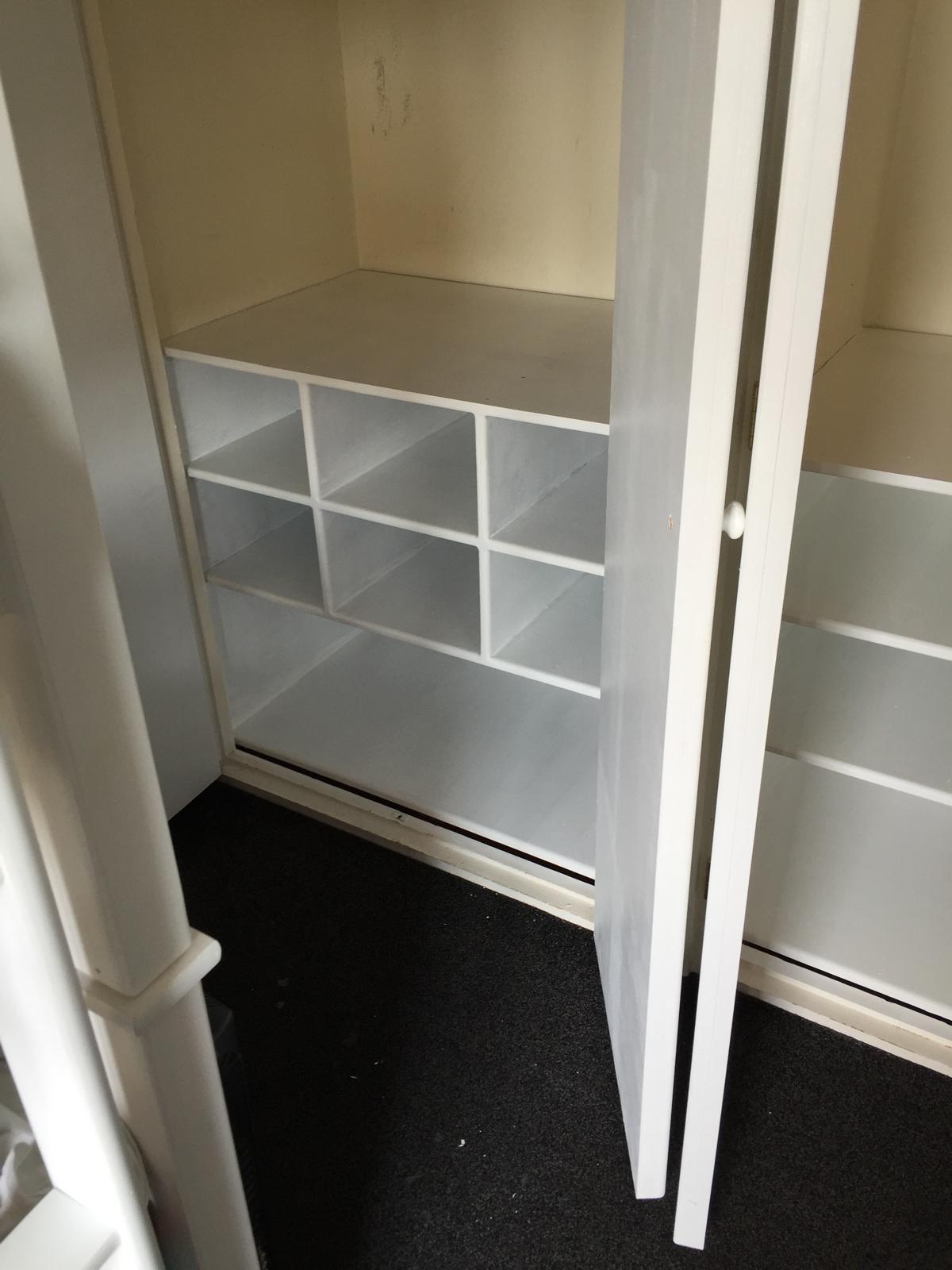 Built in bespoke shelving area inside a wardrobe