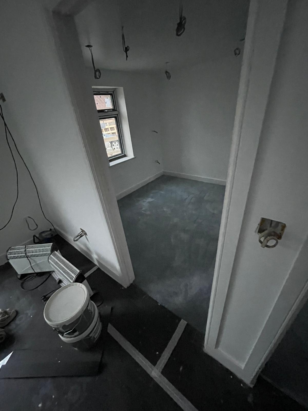 Carpets laid in a room on a conversion project