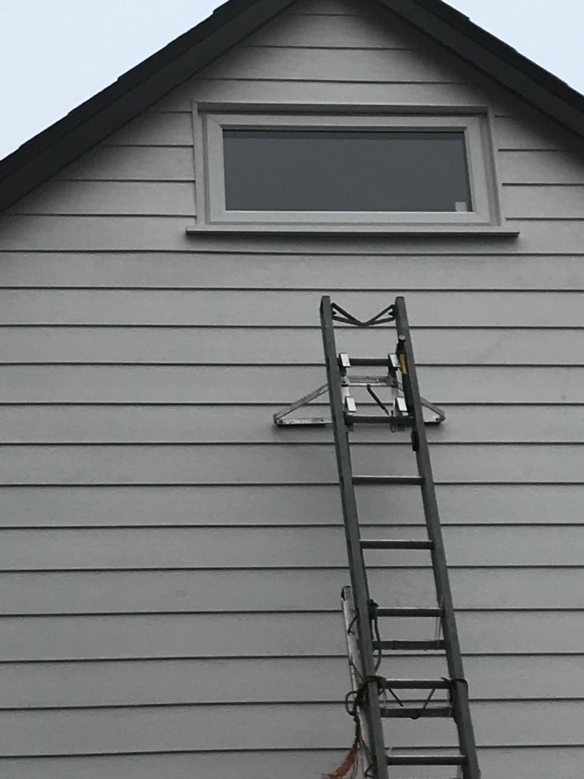 Close up by window of cladding installation