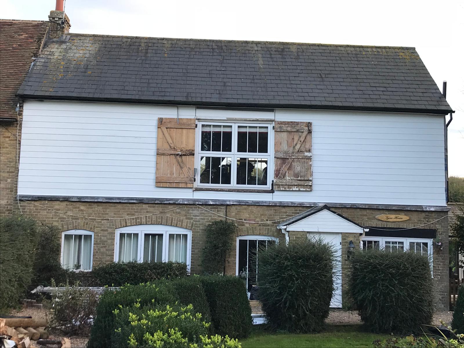 Complete front of house exterior white cladding installed for a local project in Kent