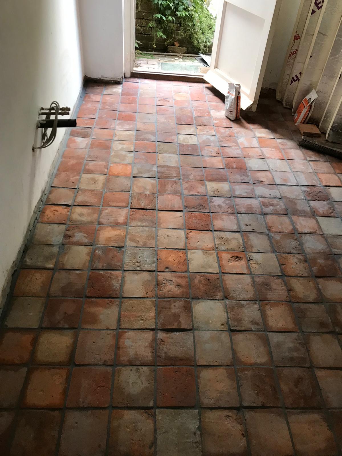 Complete installation of natural terracotta floor tiles