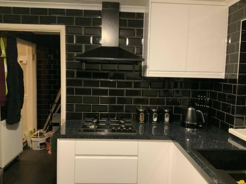 Complete kitchen black gloss wall tile installation project