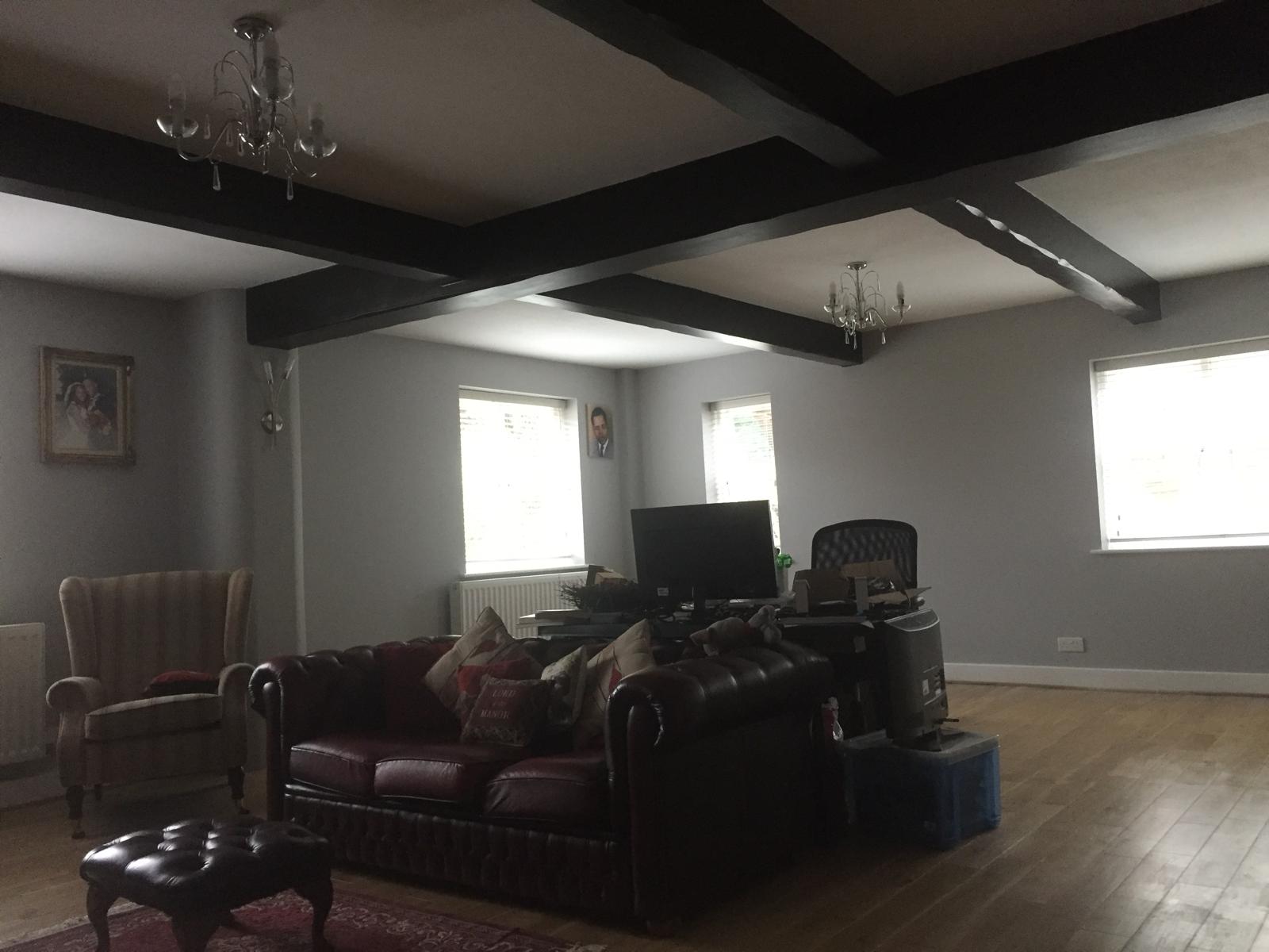 Completed painting and decorating project with grey walls white wood work and white ceilings