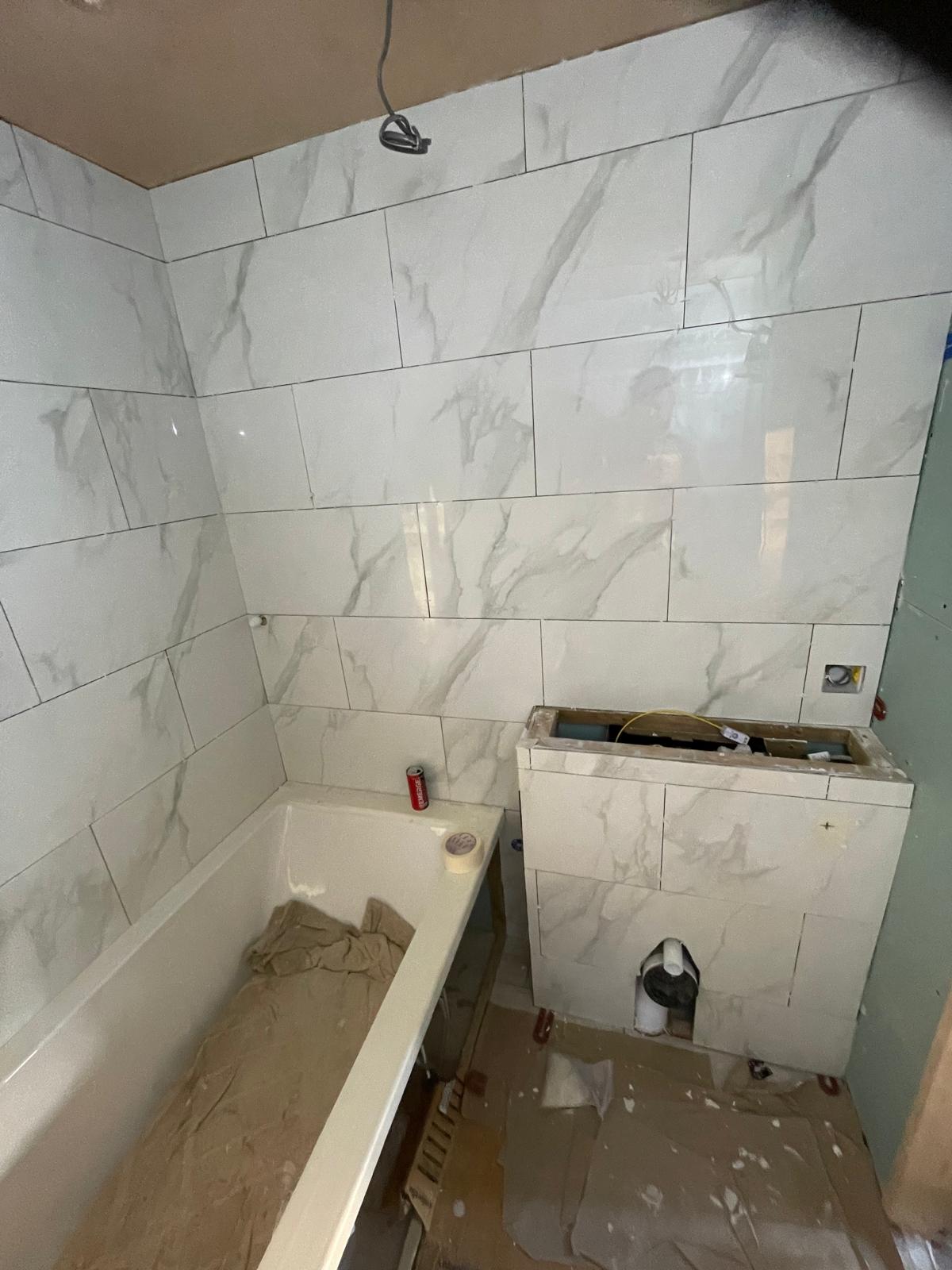 Conversion project bathroom area wall tile installation