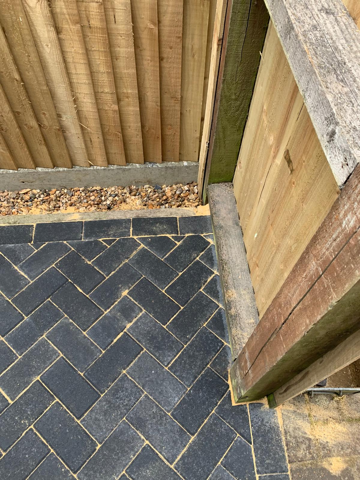 Corner area of charcoal block paved pathway area in Kent