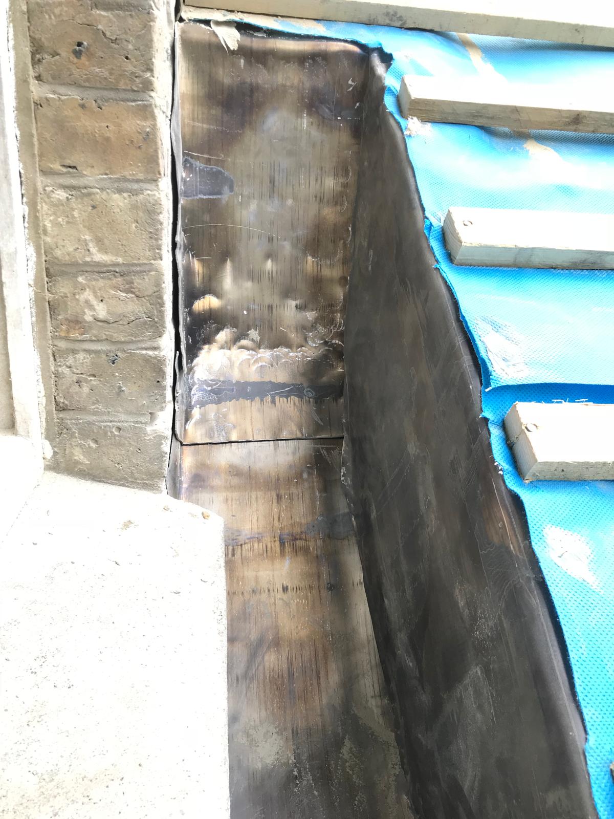 Corner lead insulation on a roof on the stone extension project