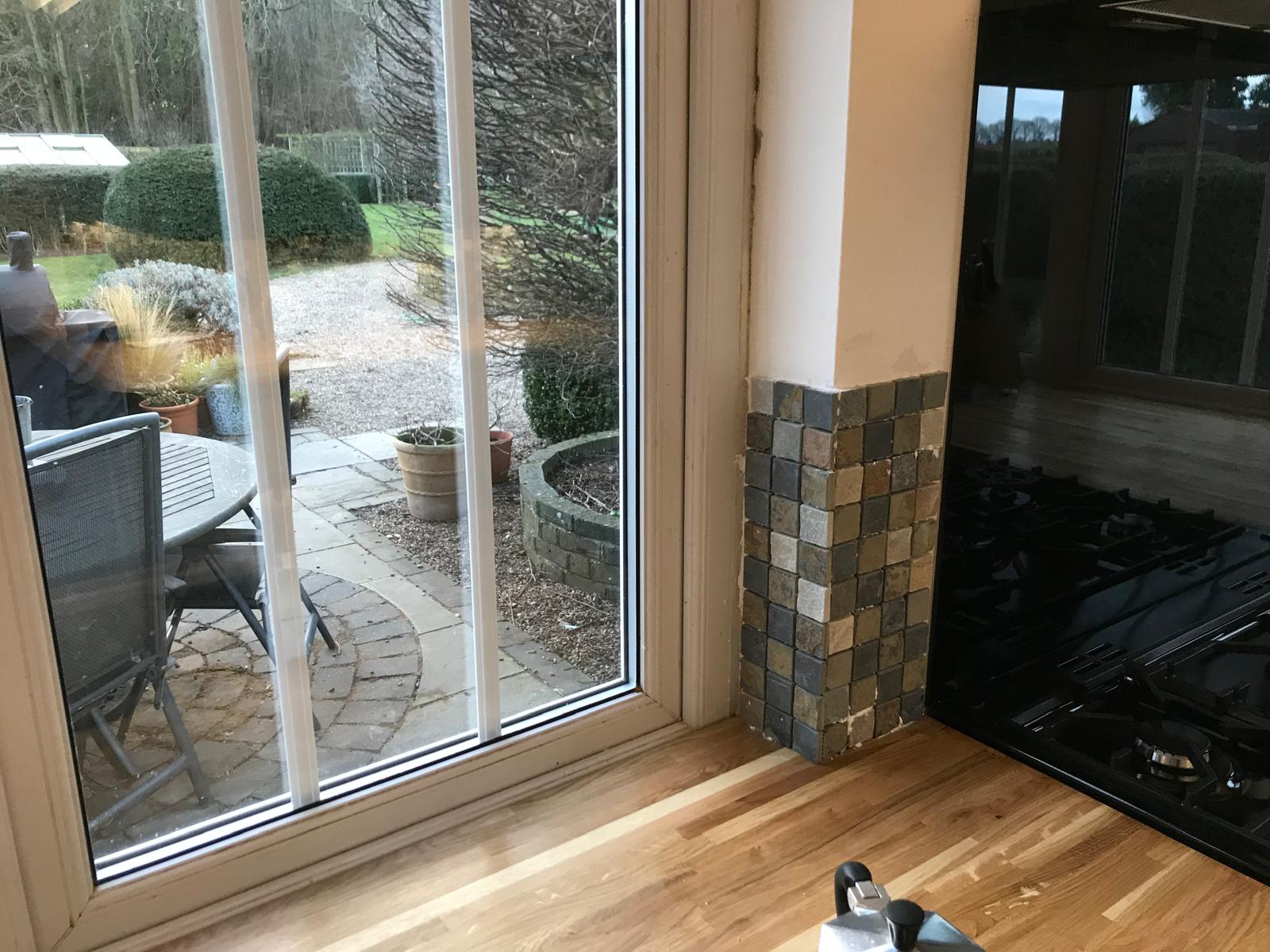 Corner natural stone mosaic wall tile installation