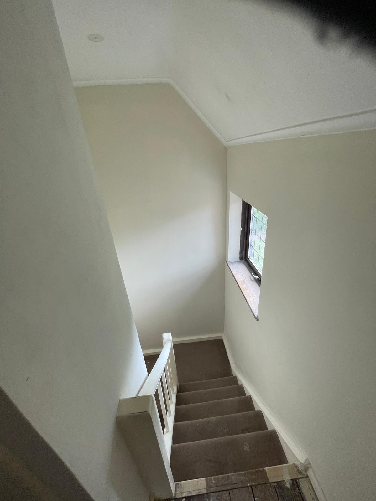 Cream painted walls on stair way area for a paint project in Kent
