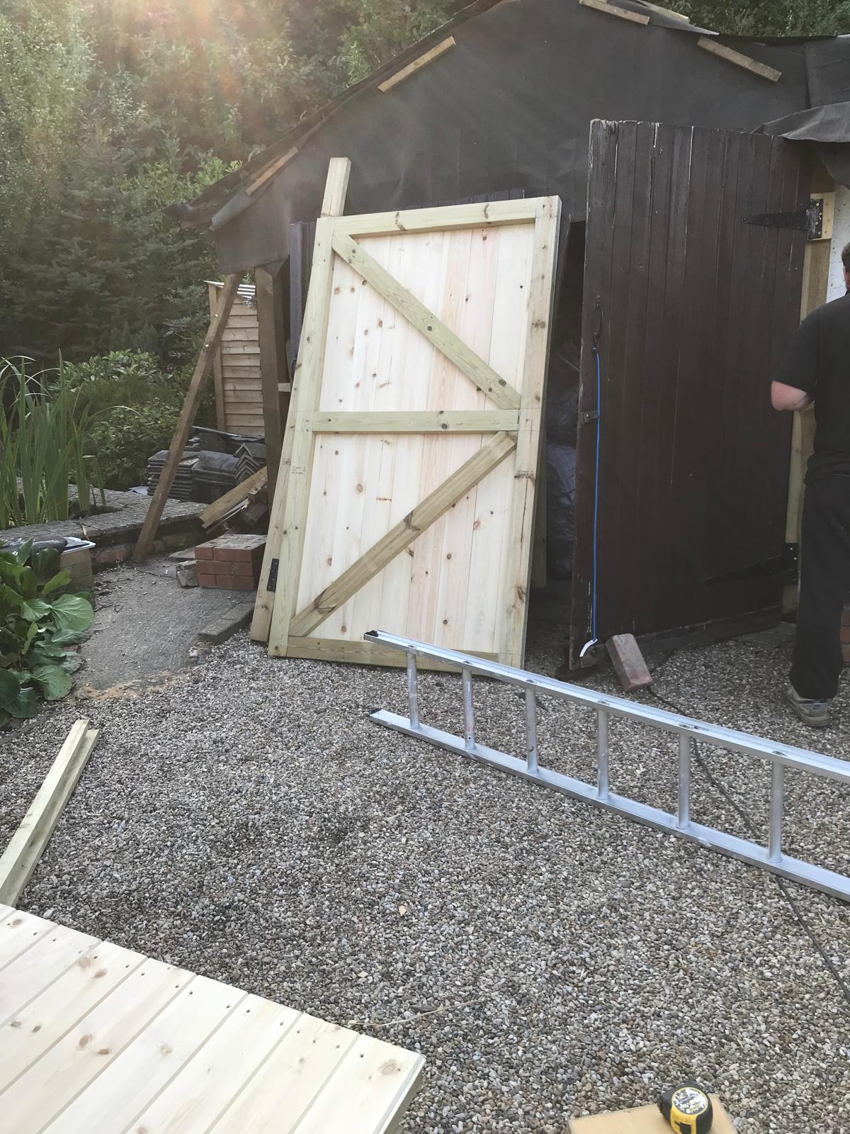 Custom doors for wooden garage installation project