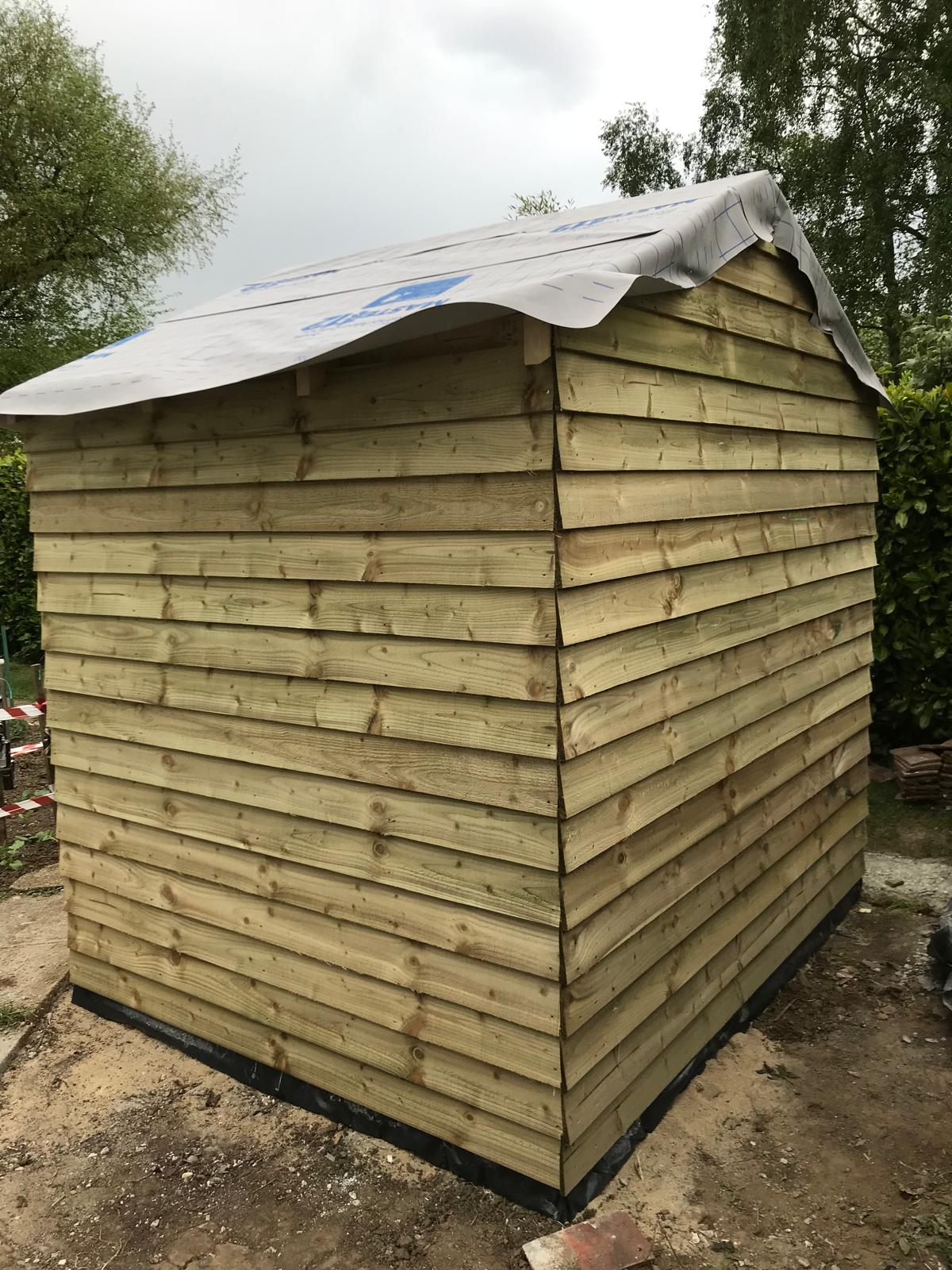 Custom shed installation on a local landscaping project