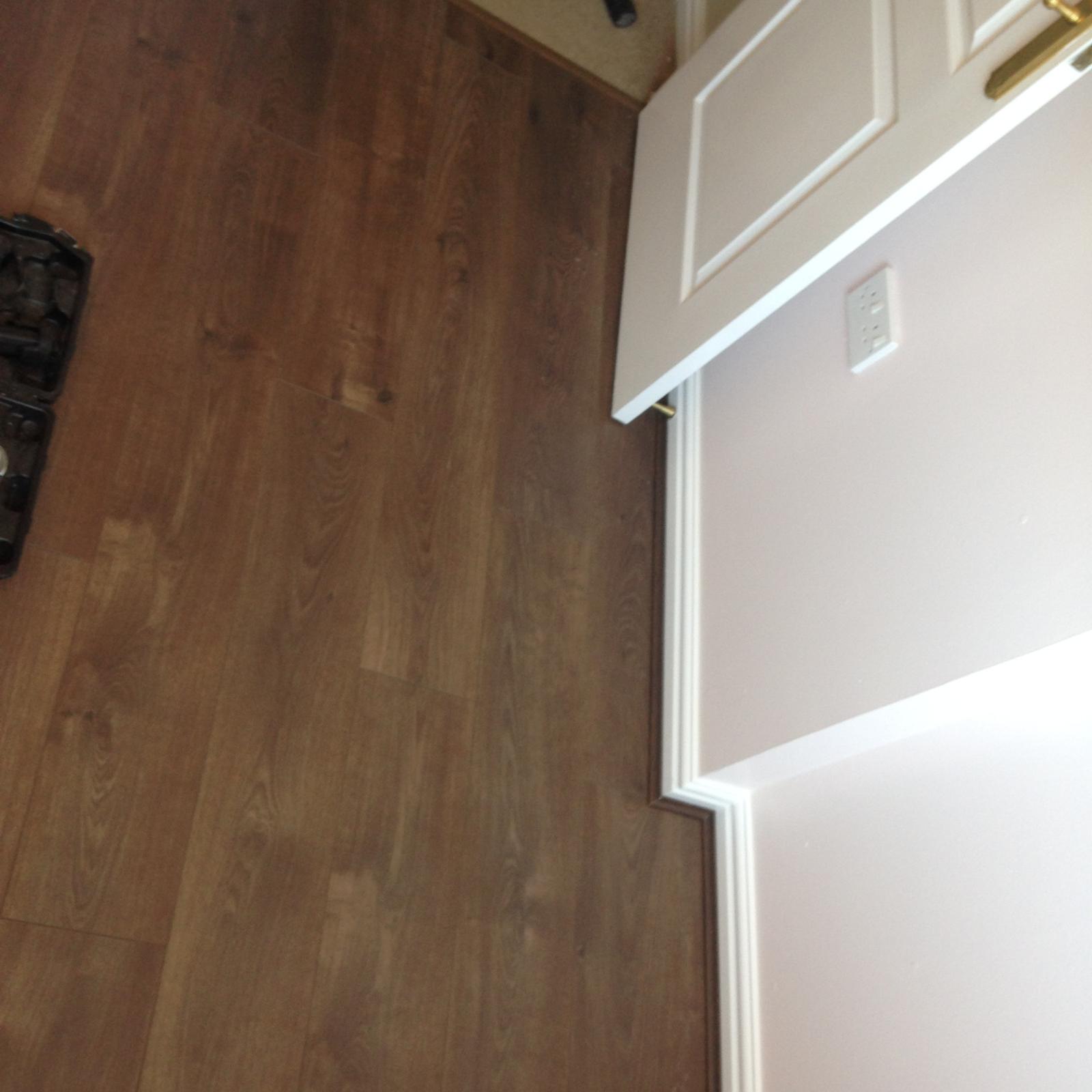 Dark brown laminate floor installation
