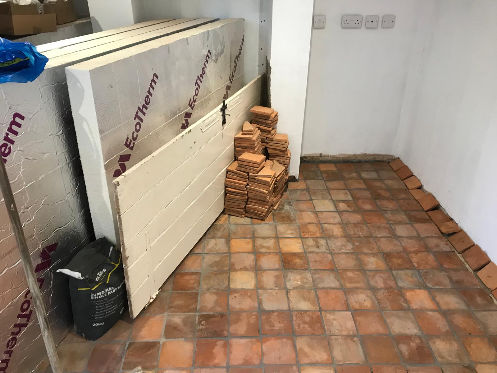 Decorating project with terracotta floor tile installation