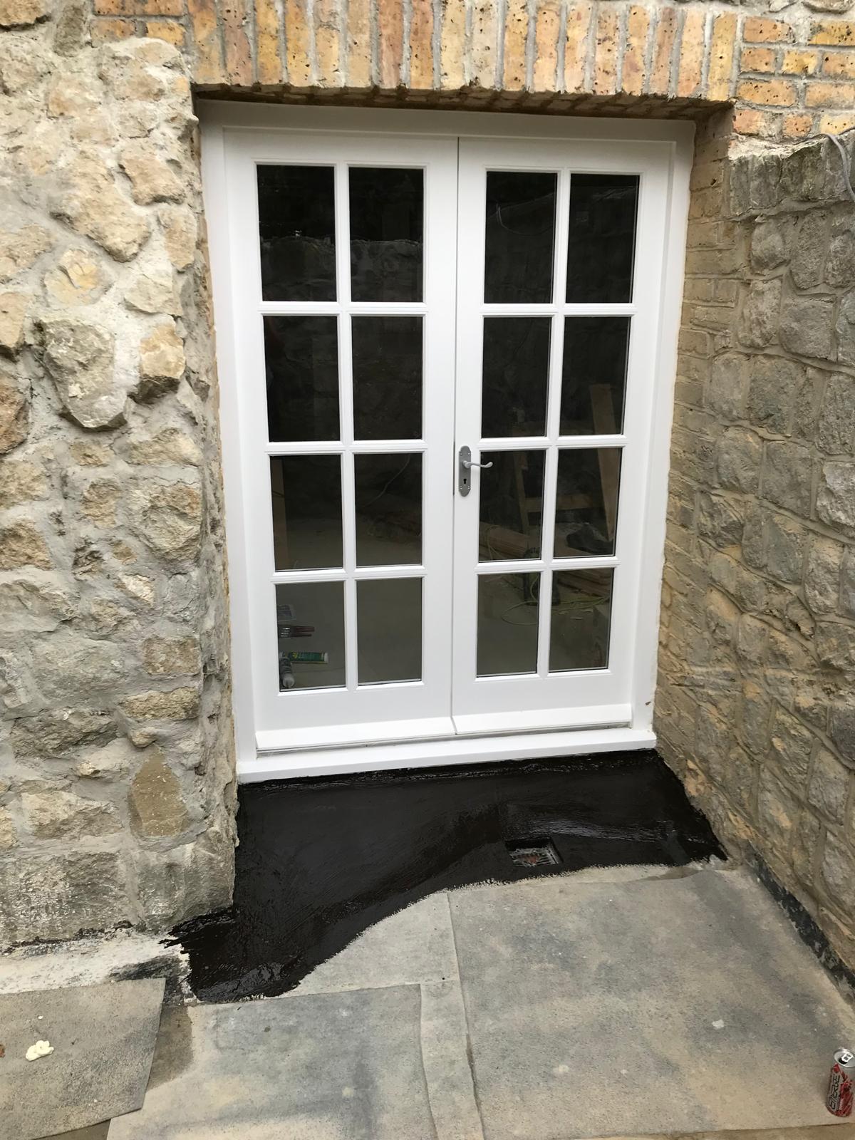 Double door installation on a stone extension project