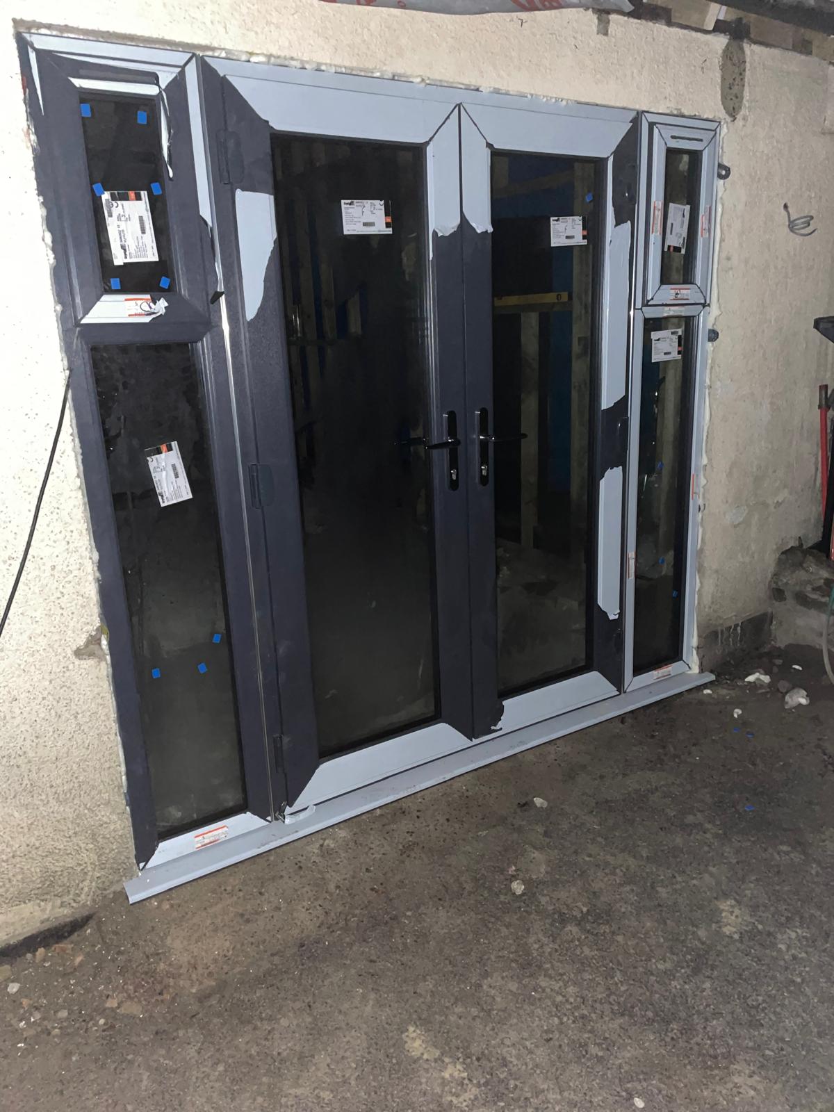 Double door with side full length window installation on a conversion project in Kent